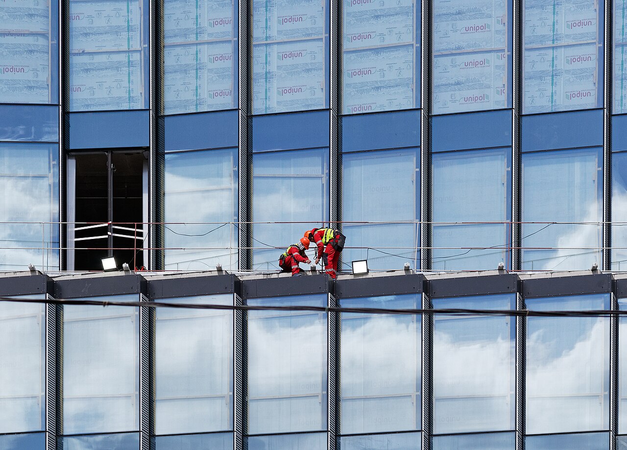 Russian construction site with workers on high-rise project